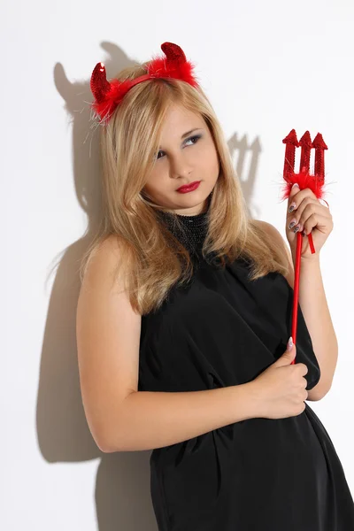 Blonde girl wearing a costume of an imp — Stock Photo, Image