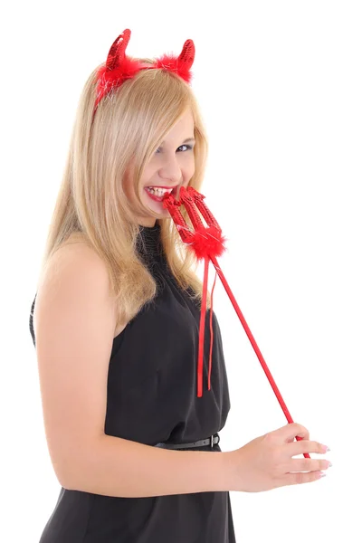 Girl in imp costume biting trident — Stock Photo, Image