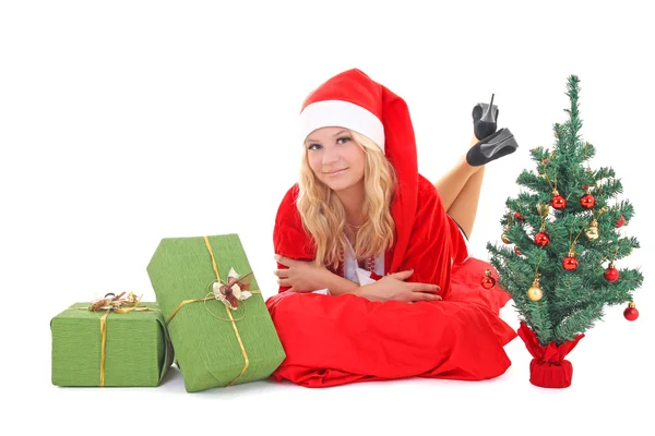 Woman in santa claus costume with gift and tree — Stock Photo, Image