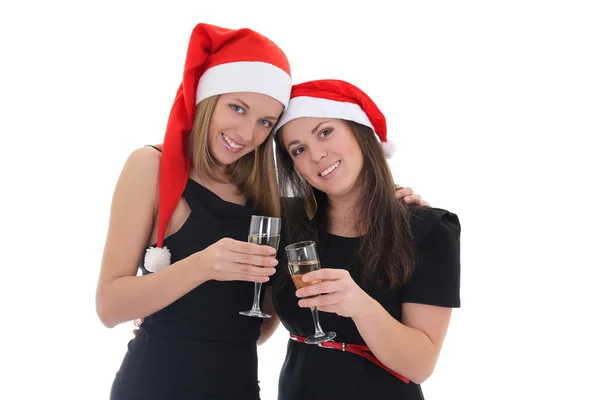 Glückliches Mädchen in Santa Hüte mit Champagner Stockfoto