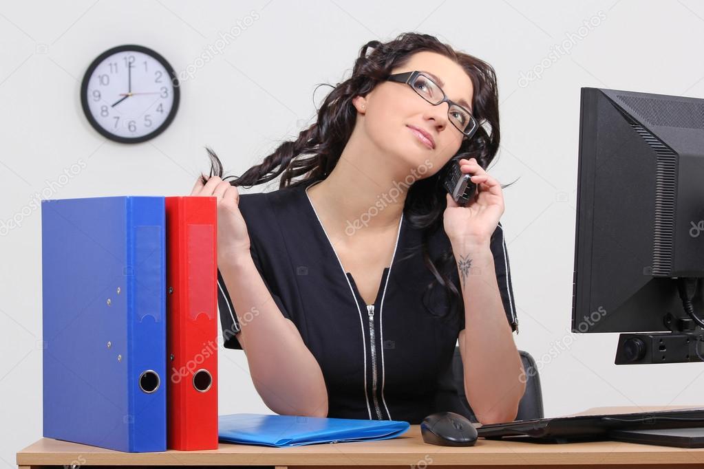 businesswoman in the office on the phone