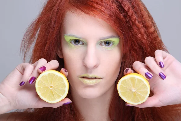 Portrait of redhaired girl with lemon — Stock Photo, Image