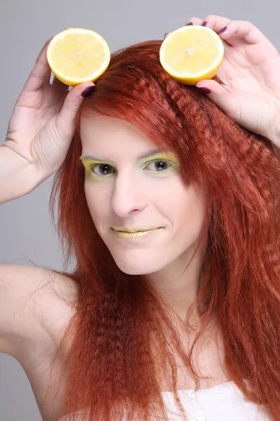 Portrait of redhaired woman with lemon — Stock Photo, Image