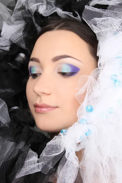 Žena s make-up a materiál — Stock fotografie