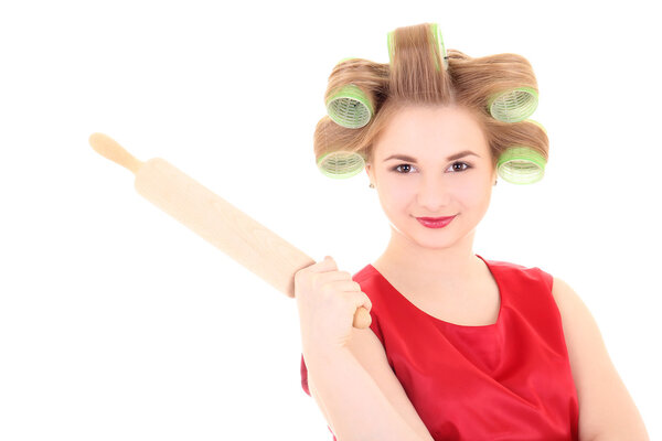 portrait of housewife with roller-pin and hair curlers