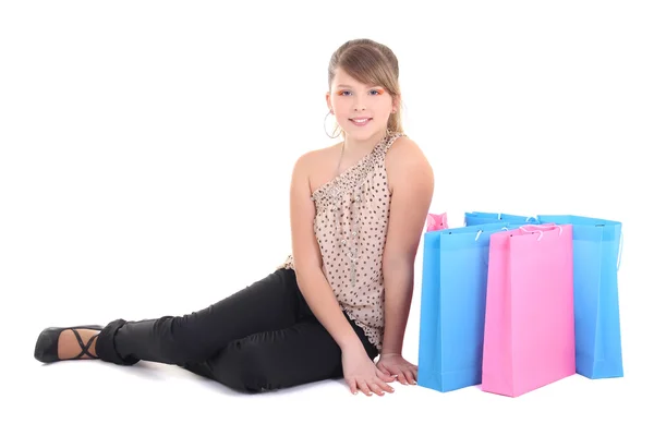 Menina adolescente feliz com sacos de compras sobre branco — Fotografia de Stock