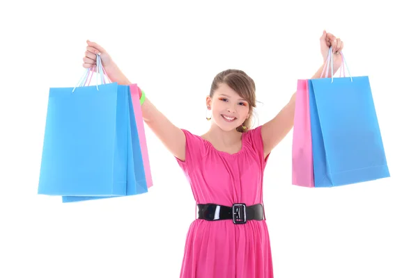 Adolescente feliz em rosa com sacos de compras sobre branco — Fotografia de Stock