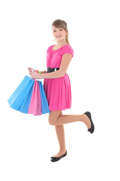 Glad tonårig flicka i rosa med kassar och påsar — Stockfoto