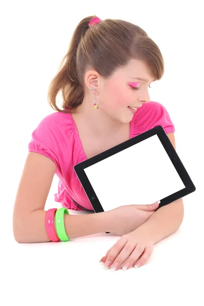 Teenage girl lying with tablet pc isolated over white — Stock Photo, Image