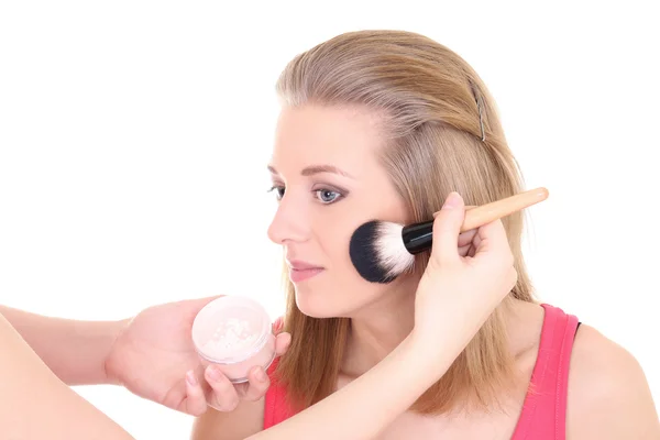 Attractive blonde with make-up brush over white — Stock Photo, Image