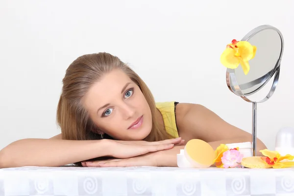 Healthy woman with make up accessories and mirror — Stock Photo, Image