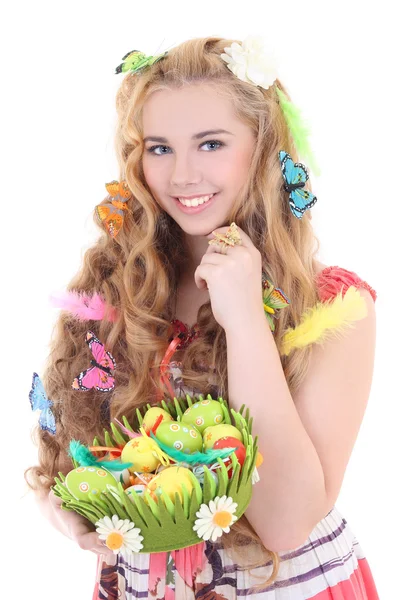 Beautiful woman holding basket with Easter eggs — Stock Photo, Image