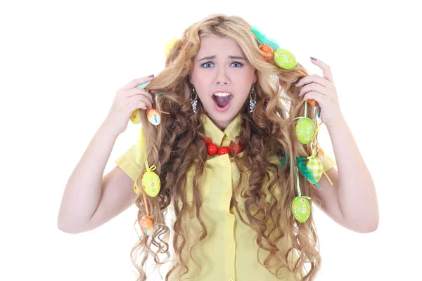 Screaming girl with easter eggs in her hair — Stock Photo, Image