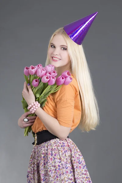 Beautiful birthday girl with flowers — Stock Photo, Image