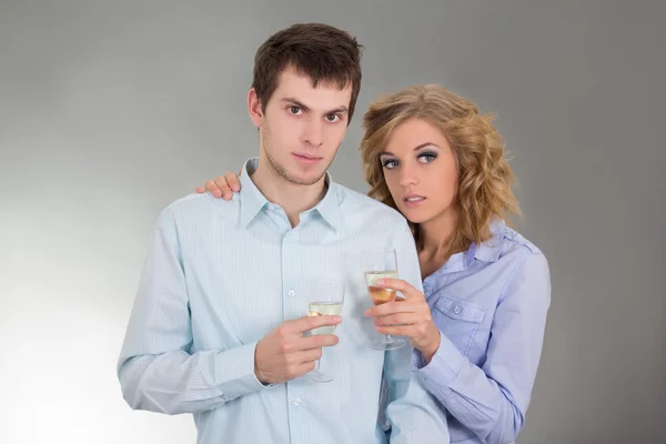 Young attractive couple with glasses of champagne — Stock Photo, Image