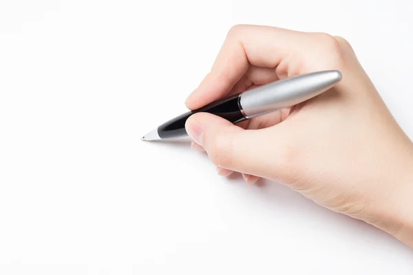 Mano femenina con pluma sobre blanco — Foto de Stock