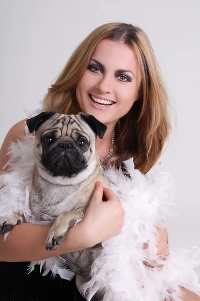 Portrait of young woman with pug dog — Stock Photo, Image