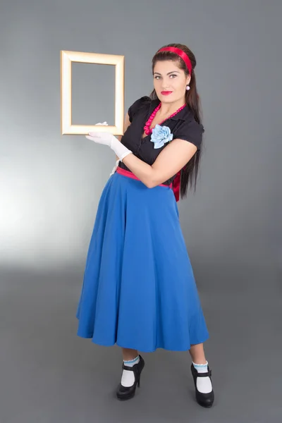 Pinup girl with photo frame — Stockfoto