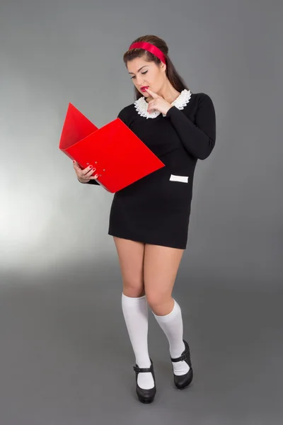 Picture of sexy woman in school form with red folder — Stock Photo, Image