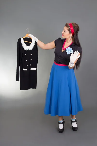 Young pinup woman trying new dress — Stock Photo, Image
