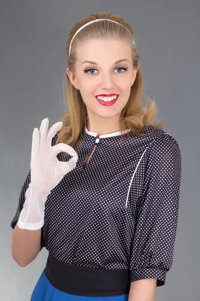 Surprised girl in retro clothes showing ok sign — Stock Photo, Image