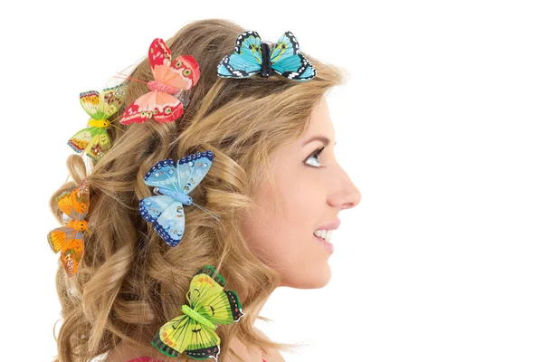 Portrait of young beautiful woman with butterflies in her hair — Stock Photo, Image
