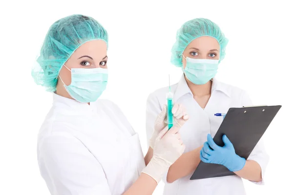 Doctor with syringe and nurse over white — Stock Photo, Image