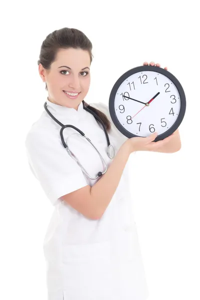 Jeune belle femme médecin avec horloge isolé sur blanc — Photo