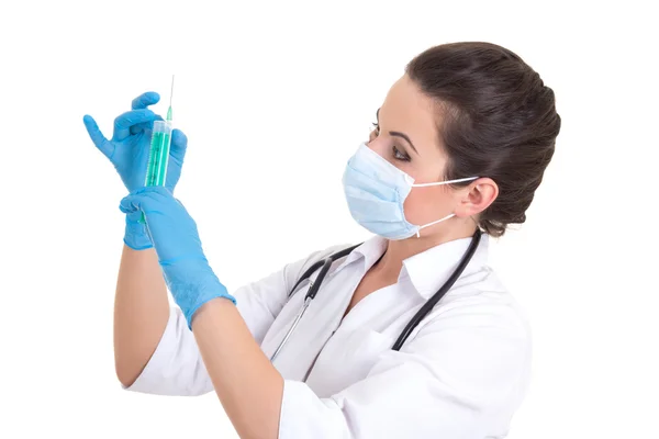 Female doctor in mask with syringe isolated on white — Stock Photo, Image