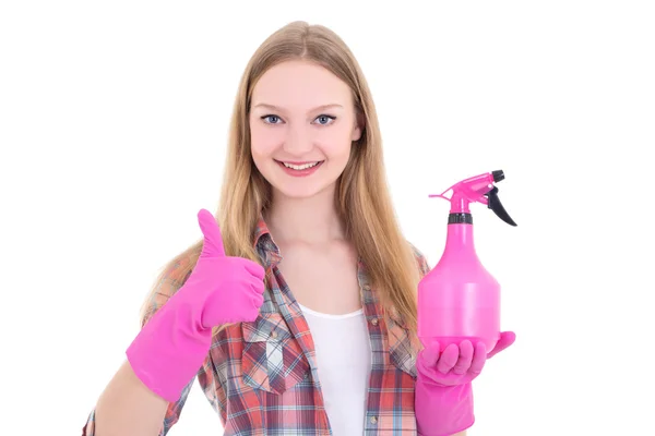 Jonge vrouw in roze rubberen handschoenen met spray duimschroef opwaarts — Stockfoto