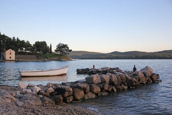 Old pier and fishing boat on the sea in Tivat — Stock Photo, Image