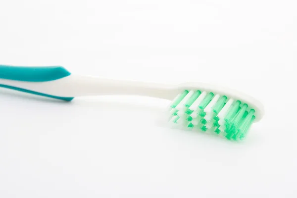 Cepillo de dientes suave verde sobre blanco — Foto de Stock