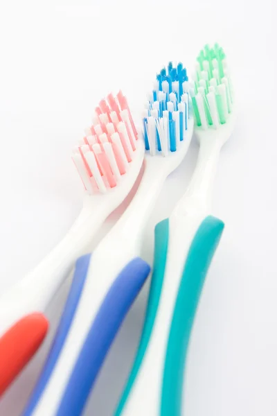 Cepillo de dientes rojo, verde y azul — Foto de Stock