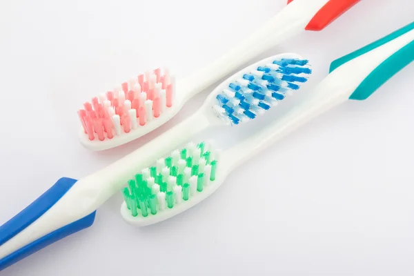 Escova de dentes vermelha, verde e azul — Fotografia de Stock