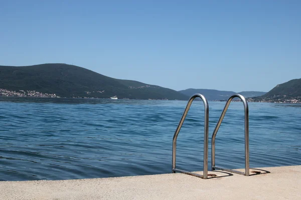 Metal ladder on the beach in Tivat — Stock Photo, Image