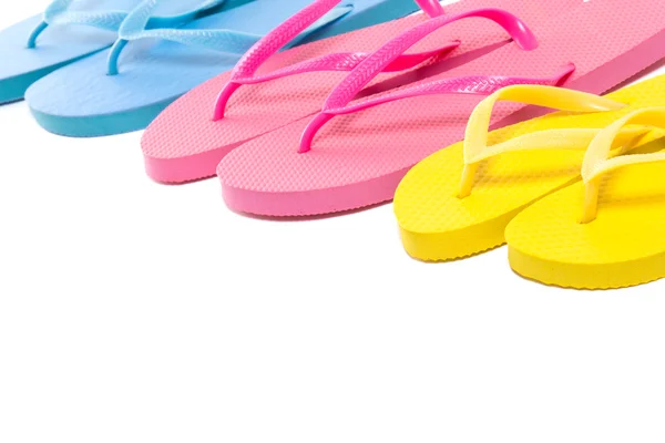 Colorful summer flip flop shoes over white — Stock Photo, Image