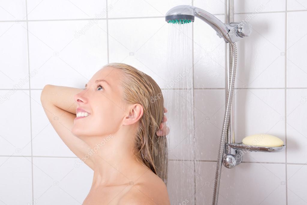 blondie woman washing hair in shower