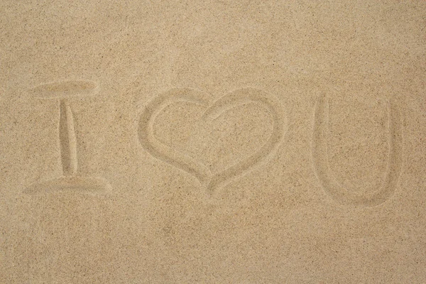 "i love you" message on the sand — Stockfoto