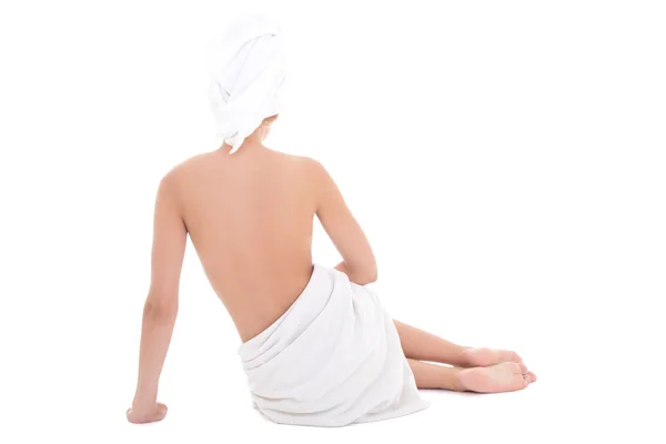 Vista posterior de una mujer hermosa toalla sentado en blanco —  Fotos de Stock