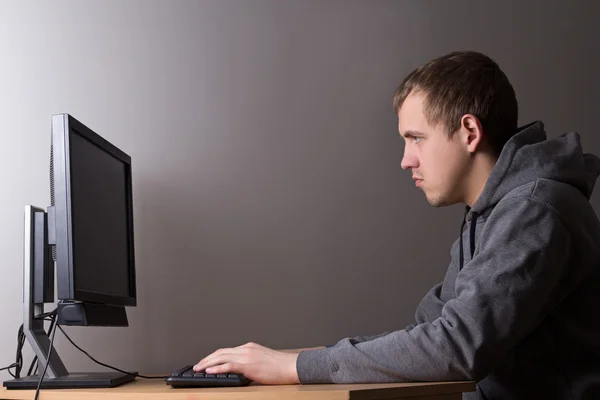 Young man working with personal computer — Stock Photo, Image