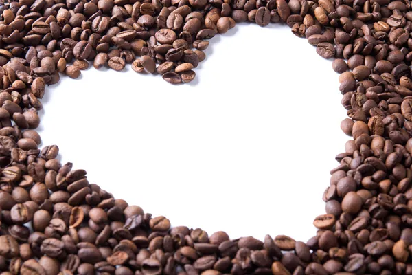 Kaffebönor i hjärtats form — Stockfoto