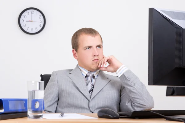 Tired business man sitting at work — Stock Photo, Image