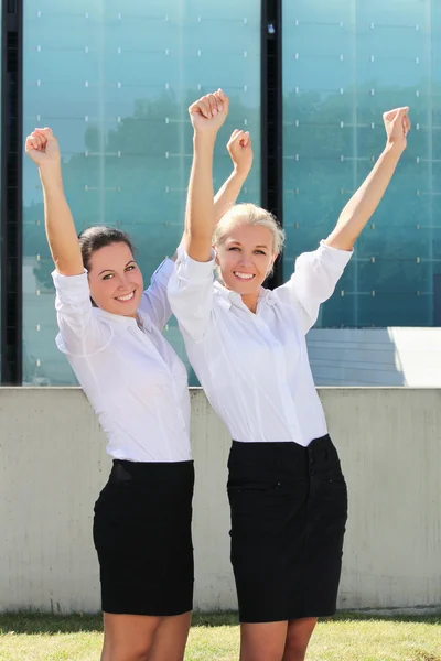 Two cheerful business women in the street — Stok Foto