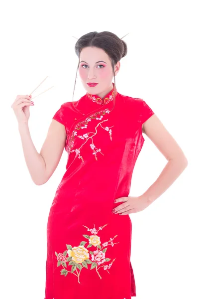 Attractive girl in red japanese dress with chopsticks isolated o — Stok Foto