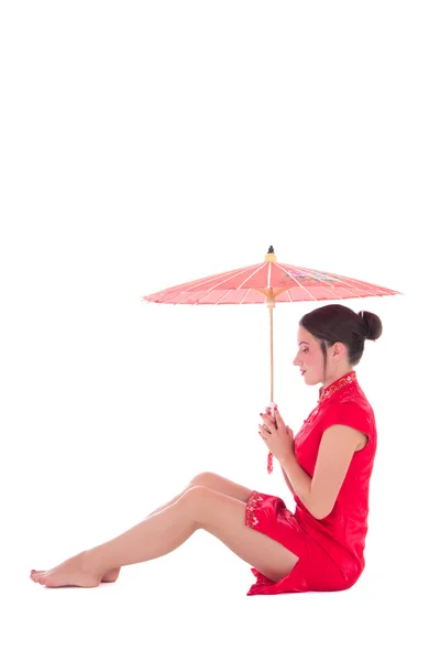 Young attractive sitting woman in red japanese dress with umbrel — Stock Photo, Image