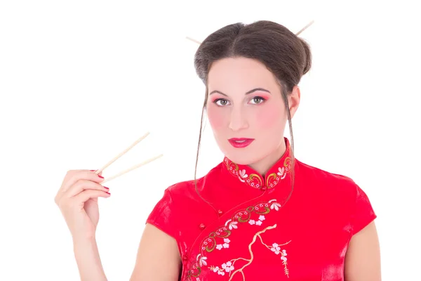 Girl in red japanese dress with chopsticks isolated on white — Stok Foto
