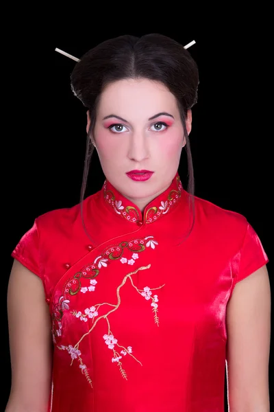 Portrait of girl in red japanese dress isolated on black — Stock Photo, Image