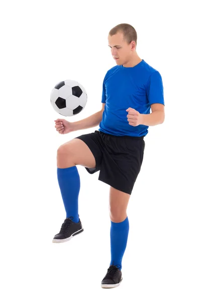 Fotbollspelare i blå uniform leker med boll isolerad på whit — Stockfoto