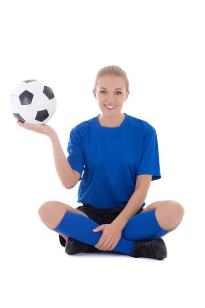 Young female soccer player in blue uniform sitting with ball iso — Stock Photo, Image