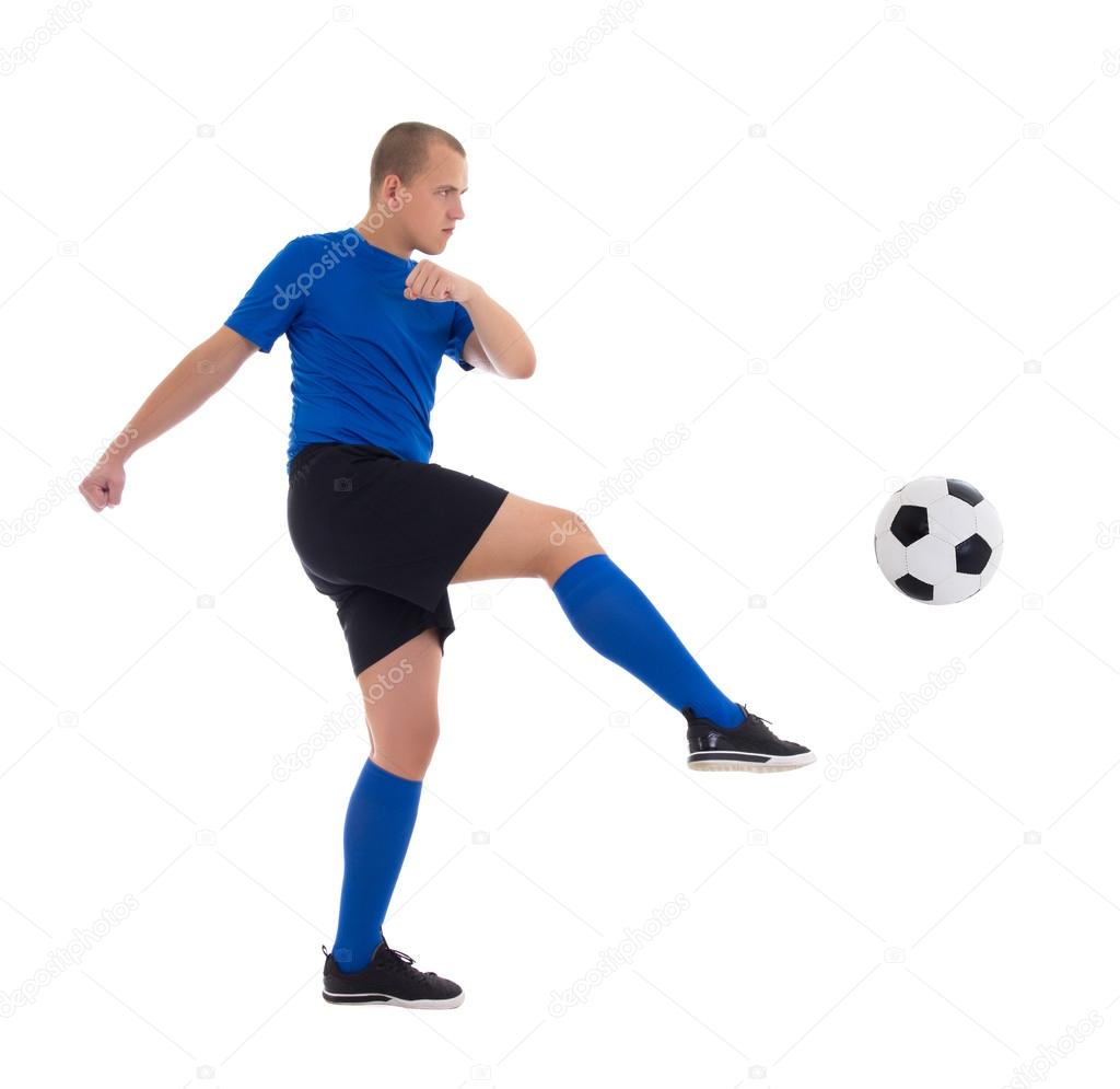 profile view of soccer player in blue kicking ball isolated on w